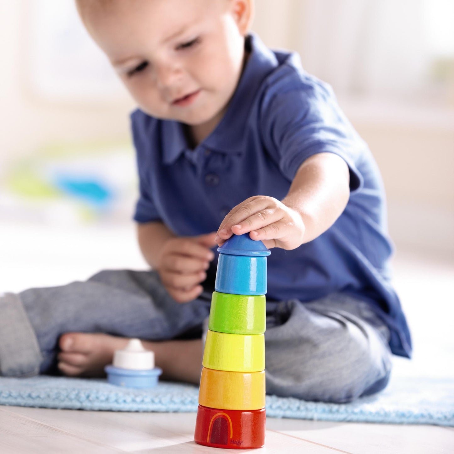 HABA Lighthouse Wooden Rainbow Stacker ‚Äì Colorful Learning Toy